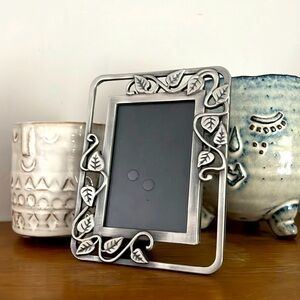 Small pewter tone frame.